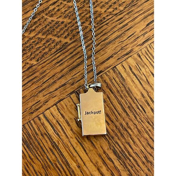 Costume jewelry gambling charm gold town, and silver tone necklace - Picture 3 of 4